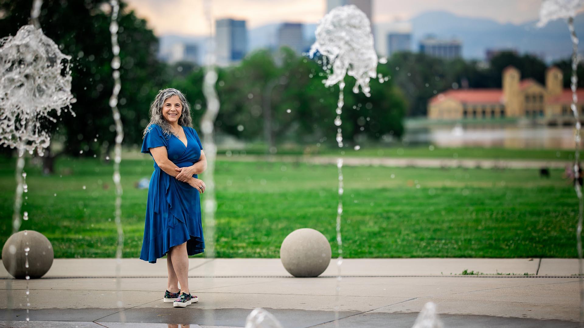 Water student standing at City Park fountain